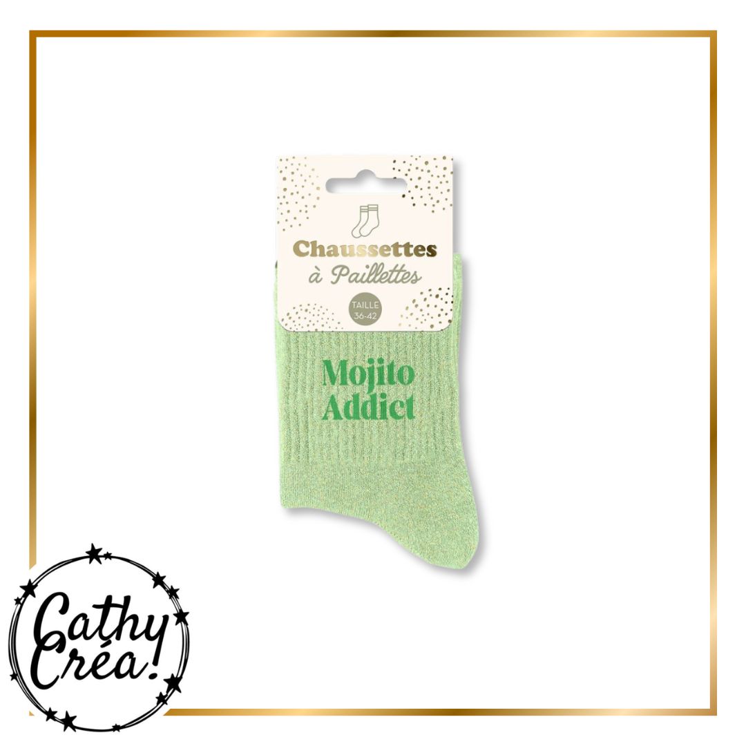 Chaussettes à paillettes Mojito Addict posées dans un décor cadeau étoiles et confettis doré