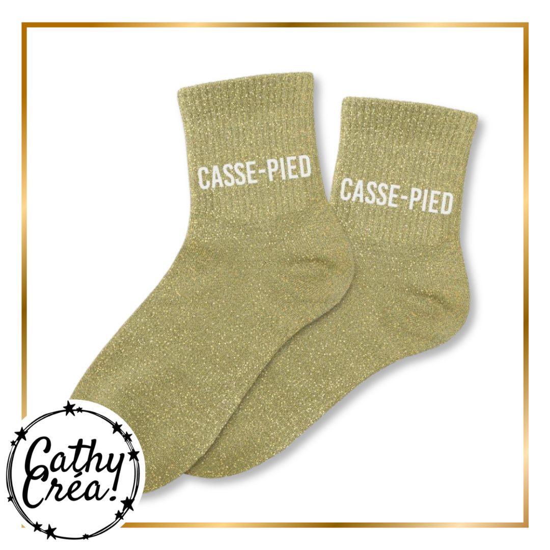 Paire chaussettes paillettes dorées inscription CASSE-PIED blanc – cadeau humour Cathy Créa